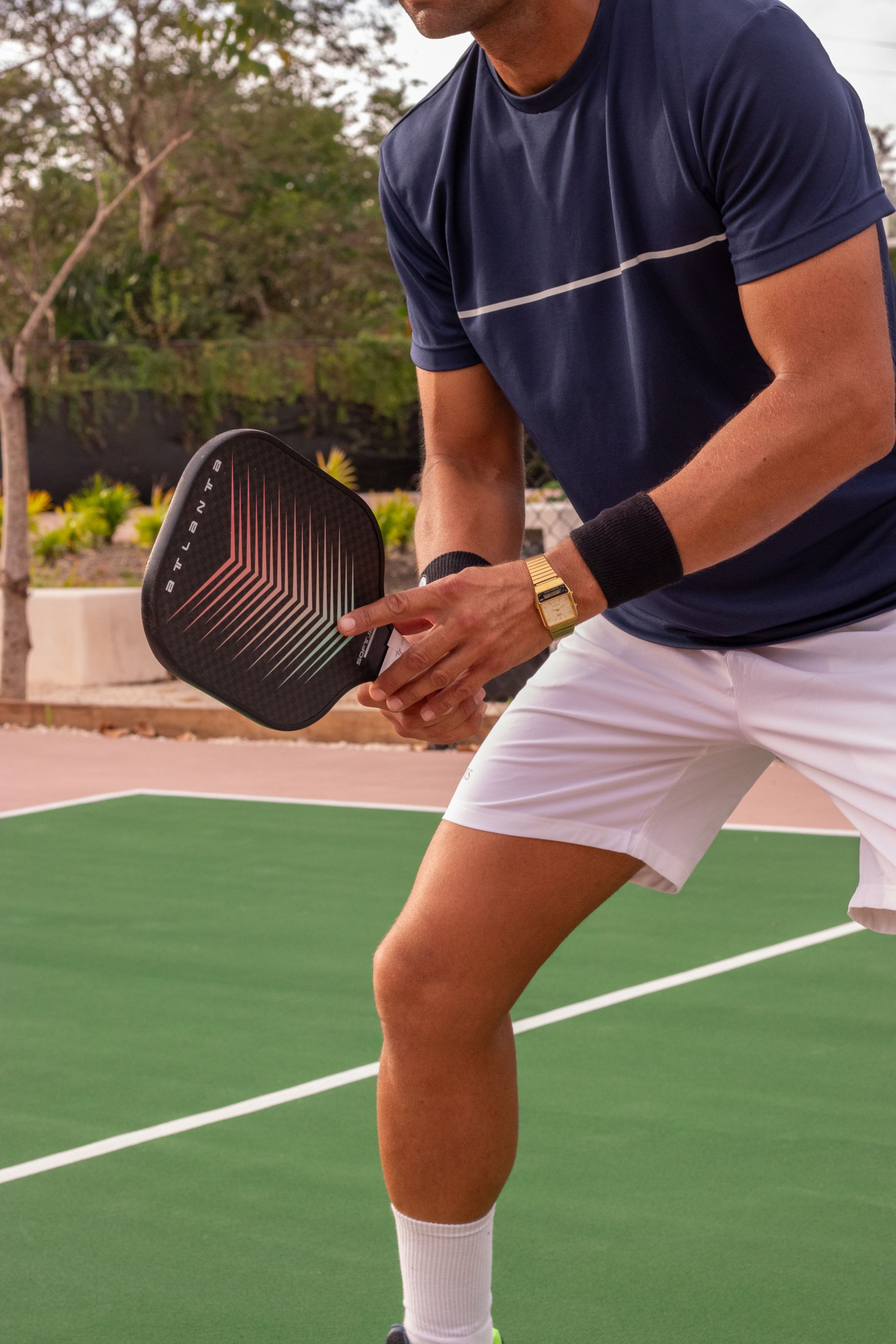 An athlete ready to return a pickleball shot
